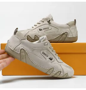 Detailed side view of khaki leather outdoor sneaker with anti-slip wavy rubber sole