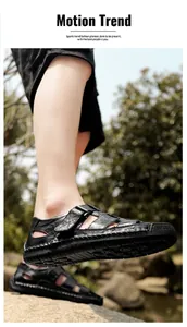 Detail of hand-stitched seams on black men's leather outdoor beach sandals