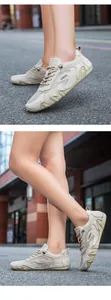 Detailed close-up of breathable mesh and suede panels on men's beige sneakers
