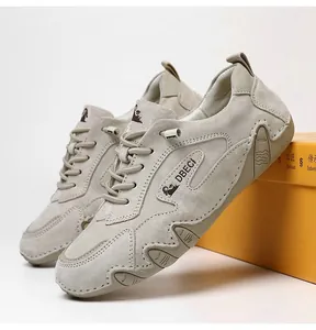Close-up of suede casual outdoor shoes with classic lacing and durable rubber sole edge