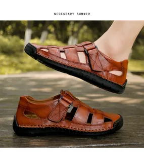 Detail of brown leather sandals with hand-stitched seams and adjustable velcro straps