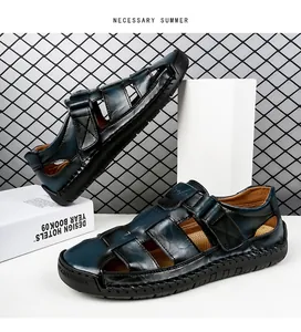 Close-up of navy leather cage sandals showing handmade stitching and rubber sole details