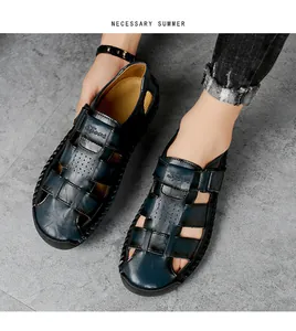 Macro detail of hand-stitched leather on men's navy blue breathable summer sandals