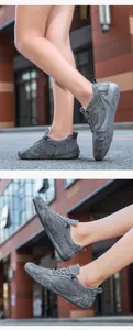 Close-up of grey breathable mesh and suede upper on casual outdoor sports sneakers