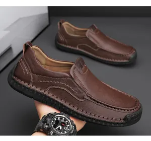 Detailed close-up of dark brown leather loafer with distinctive manual stitching craftsmanship