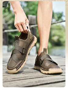 Detail of men's olive green breathable mesh sandals with rugged rubber sole and stitching
