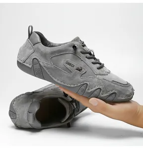 Detail of grey leather casual shoe showing non-slip rubber sole and suede texture