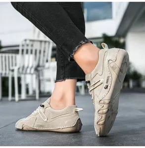 Detail of khaki leather outdoor sneaker featuring elastic laces and anti-slip rubber sole