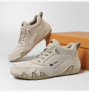 Detail showing hand-stitched seams and durable rubber sole on beige leather boots