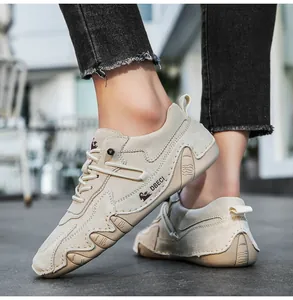Outdoor shot of low-top leather sneaker showing wave-patterned non-slip rubber sole