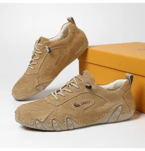 Detail of brown suede outdoor shoes with anti-slip rubber sole and elastic laces