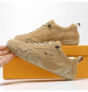 Detail of DBECI light brown suede driving shoes featuring rubber pebble sole and branding