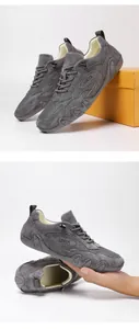 Close-up of grey breathable mesh sneaker being flexed to show sole flexibility