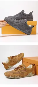 Detail of breathable mesh and suede panels on outdoor trekking shoes in grey and brown