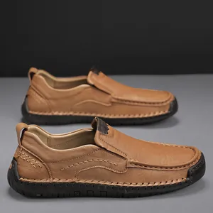 Men's brown leather slip-on shoes with hand-stitched moccasin details and rubber soles