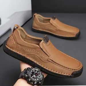 Men's khaki slip-on leather shoes with handmade moc-toe stitching and non-slip rubber soles