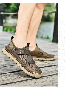 Close-up of brown mesh sandals with breathable fabric and adjustable velcro strap outdoors