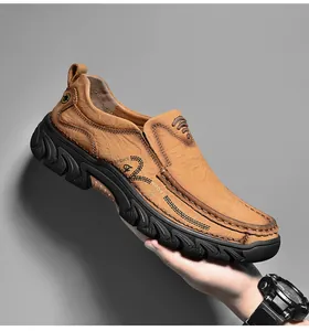 Macro shot of brown leather slip-on shoes featuring durable rubber soles and hand-stitched detail