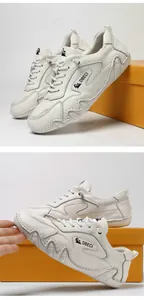 Detailed side view of off-white leather outdoor sneakers with wavy stitching and brand logo