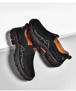 Detail of black suede leather shoe featuring thick non-slip sole and sport stitching