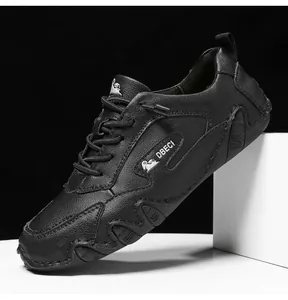 Detailed view of the anti-slip rubber sole and leather texture of these black casual sneakers