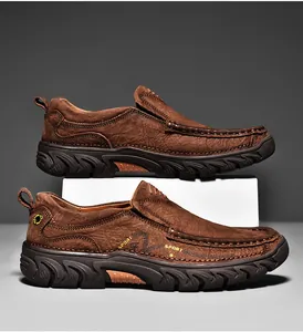 Close-up of brown leather men's shoe featuring artisan hand-stitching and sport logo detail