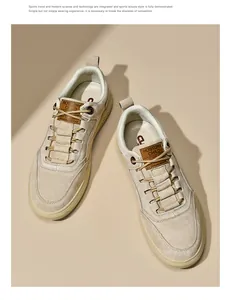 Top-down view of cream suede and fabric men's sneakers with premium logo and round laces