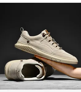 Detailed close-up showing texture and honeycomb sole of beige suede casual sneakers
