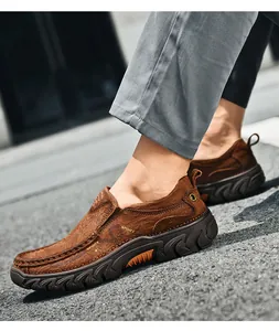 Close-up of brown leather outdoor shoes with durable non-slip rubber soles and stitching