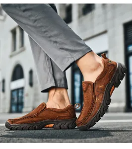 Detail of brown slip-on shoe with sport embossing and anti-slip thick rubber sole