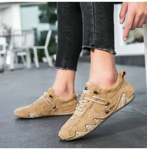 Close-up of khaki nubuck leather casual shoe featuring hand-stitched details and slip-on design