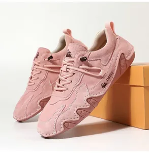 Detail of pink suede leather casual sneaker with textured rubber sole and DBECI branding
