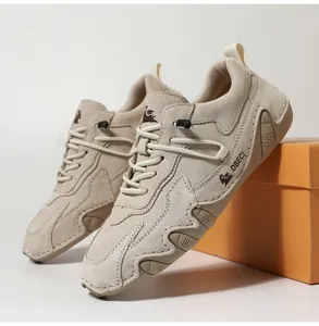 Detail view of khaki suede leather casual sneaker with adjustable elastic lace and logo