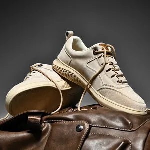 Men's casual cream sneakers featuring suede patchwork and a textured rubber sole