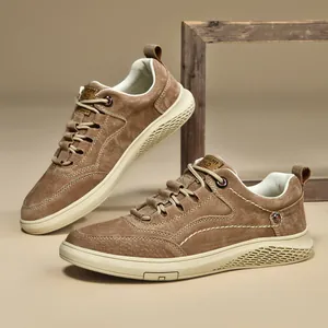 Brown suede men's casual sneakers with thick white soles and decorative stitching detail