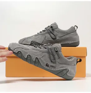 Detail of grey suede casual shoe featuring non-slip rubber sole and lace-up design