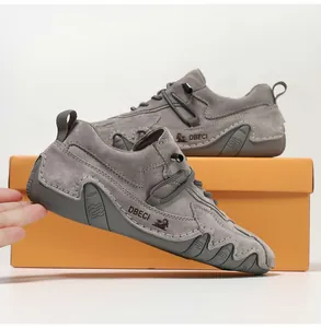 Detailed close-up of handmade dark grey suede shoes with anti-slip rubber sole