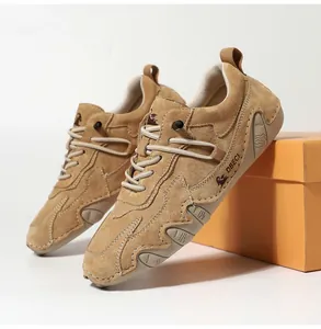 Detail of khaki suede casual men's shoe with handmade stitching and DBECI side logo