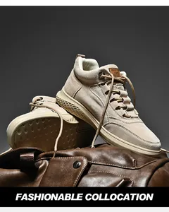 Close-up of beige suede high-top sneakers with thick rubber soles and fine stitching