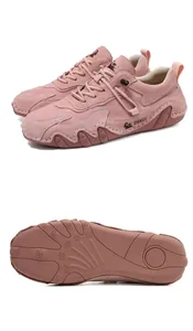 Detailed macro view showing suede leather texture and durable wave-patterned rubber sole