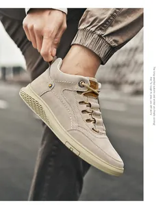 Detail of khaki suede high-top sneakers showing fine stitching and durable rubber sole