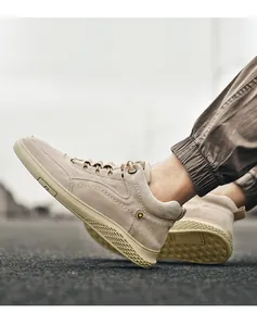 Detail of khaki high-top sneaker with suede texture and honeycomb rubber sole