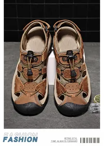 Detailed top view of brown outdoor sandals with protective toe cap and drawstring laces