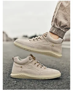 Close-up of khaki high-top casual shoes featuring suede finish and detailed stitching