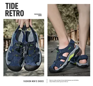 Detail of dark blue men's closed-toe beach sandals with a quick-lace system