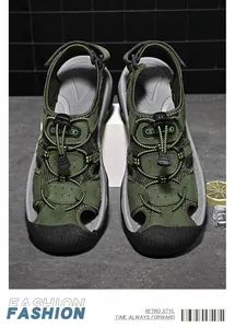 Detail of army green outdoor closed-toe sandals with drawstring laces and leather mesh