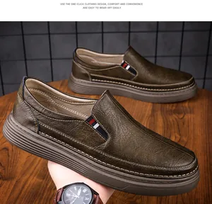Detail of dark textured leather slip-on shoe with side webbing and thick rubber sole