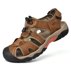 Close-up of brown leather hiking sandals with closed-toe design and drawstring laces