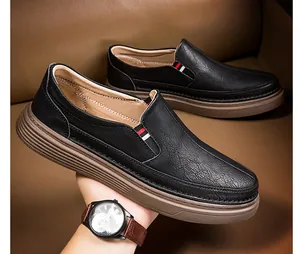 Detail of men's black loafers with slip-on elastic band and durable non-slip rubber sole