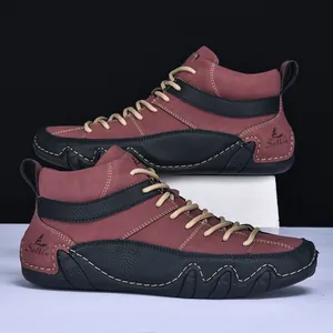 Detailed side view of high-top outdoor boots with Salkin branding and wavy rubber sole